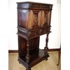 CARVED OAK LIVERY CABINET ON STAND LATE 18TH CENTURY.