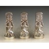 Garniture of three Victorian cast silver Pepper Pots in the form of Punch and Judy Puppet Booths