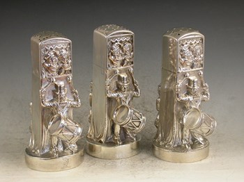 Garniture of three Victorian cast silver Pepper Pots in the form of Punch and Judy Puppet Booths